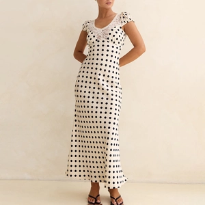 Satin polka dot maxi dress with V-neck, lace trim, and slimming waist in beige and black