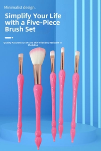 Detail of pink spiral handle makeup brushes with soft synthetic rose gold ferrule bristles