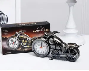 Detailed view of motorcycle shaped alarm clock with packaging and quartz movement dial