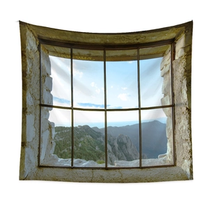 Scenic nature tapestry with a rustic stone window frame showing mountains and lush forest