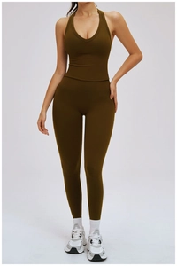 Detail of olive green yoga set with halter neck sports bra and high waisted leggings