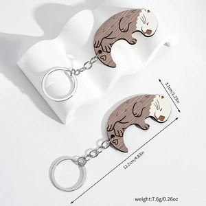 Wooden otter couple keychains with measurements 3.1cm height and 12.2cm total length