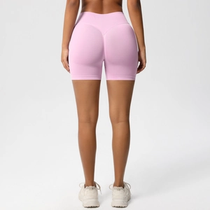 Rear view of pink seamless high-waist fitness shorts with V-shape scrunch butt lifting detail