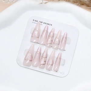 Handmade stiletto press-on nails with pink cat-eye effect and 3D heart-shaped embossed design