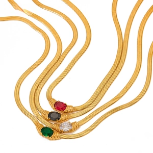 Detail showing four gold snake chain necklaces with colorful oval gemstone pendants