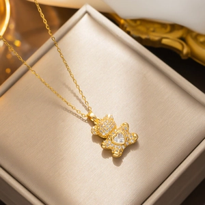Gold bear pendant necklace with heart crystal and pavé diamonds in jewelry box