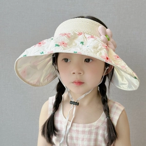 Close-up of girls sun hat featuring floral pattern and adjustable chin strap