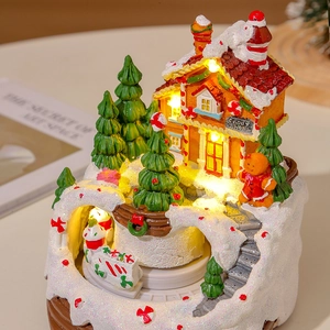 Lighted musical Christmas candy shop house with warm LED lights and gingerbread man decor