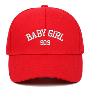 Close-up of Baby Girl 90's white 3D embroidery on a vibrant red cotton baseball cap