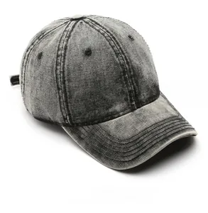 Detail view of washed denim baseball cap showing six-panel stitch and vintage grey fabric