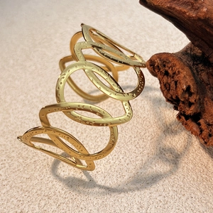 Vintage gold-plated geometric hollow cuff bracelet with hammered texture and open design