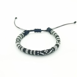 Handmade bohemian black and white woven surf bracelet with adjustable sliding knot closure
