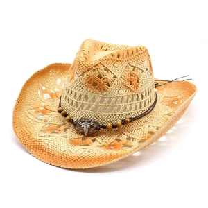Straw western cowboy hat with hollow patterns, bull head ornament and orange gradient edge