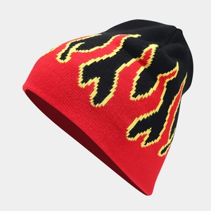 Hip hop knit beanie with red and yellow flame pattern on black background