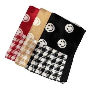 Winter knitted scarves with smiley patterns and houndstooth texture in red and khaki