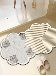 Detail of flower shaped diatomaceous earth bath mats with absorbent texture and non-slip base