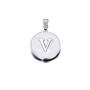 Macro view of a round silver pendant with white mother-of-pearl and 3D letter V