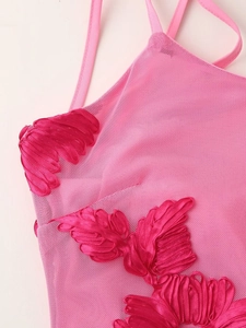 Detailed close-up of pink mesh dress featuring elegant 3D ribbon floral embroidery