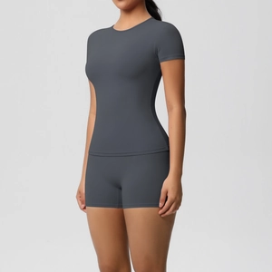 Detailed front view of high-elastic dark grey yoga set with slim fit top and high waist shorts