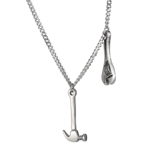 Industrial style silver chain necklace featuring miniature metal hammer and wrench pendants