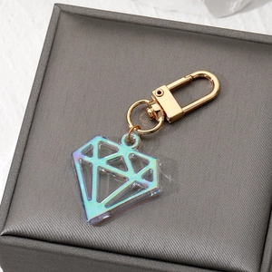 Iridescent acrylic diamond pendant keychain with golden lobster clasp and metallic finish