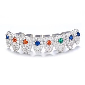 Macro detail of silver hip hop grillz featuring multi-color round zircon stones