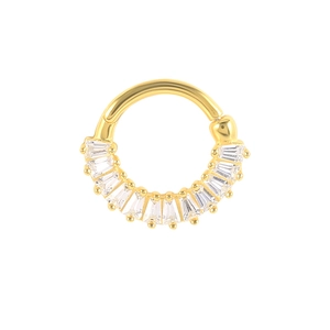 Detailed close-up of golden S925 sterling silver hoop ring with baguette cut clear gemstones