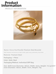 Detail of 18k gold plated titanium horseshoe bangle with Roman numeral pendant