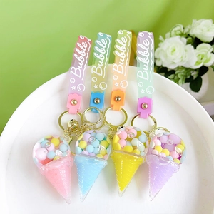 Glow-in-the-dark acrylic ice cream keychains with colorful liquid oil and floating beads