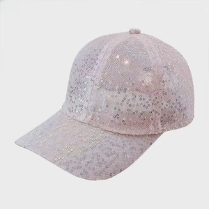 Close-up of pink sequined baseball cap showing breathable mesh and shiny circular sequins