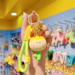 Cute yellow tulip flower keychain with green strap and small golden bell charm