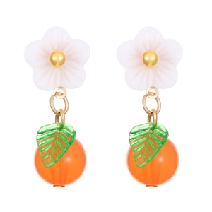 Close-up of handmade floral earrings with green leaf and orange fruit bead detail
