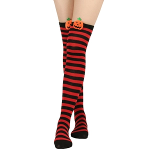 Detail of Halloween over-the-knee socks with red stripes and 3D pumpkin decoration