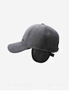 Detailed side view of grey herringbone wool baseball cap with foldable ear flaps