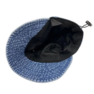 Vintage washed denim bucket hat with adjustable interior drawstring for sun protection