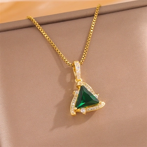 Elegant gold triangle necklace with green crystal and zircon stones on a gift box