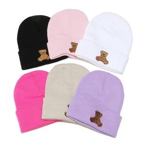 Cozy ribbed knit beanies in six colors with cute bear embroidery for winter warmth