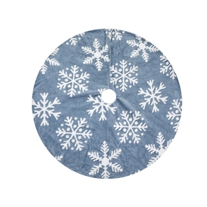 Blue soft plush Christmas tree skirt with white snowflake patterns on a white background