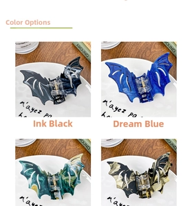 Showcase of four bat-shaped hair claws in varied marble textures for Halloween gothic style
