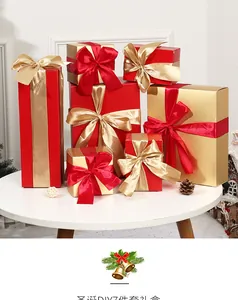 7-piece set of red and gold Christmas gift boxes with ribbons on white table display