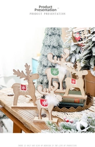 Set of four wooden Christmas reindeer ornaments with snowflake patterns and white collars