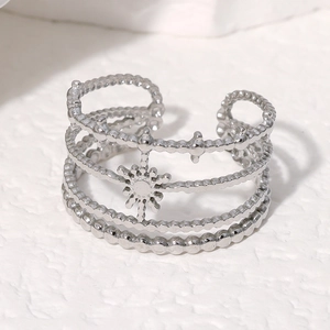 Detail of silver bohemian open ring with four-layer beaded bands and sunburst motif