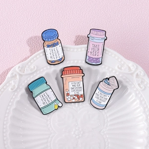 Set of 5 colorful enamel prescription bottle pins with Take Your Meds mental health text