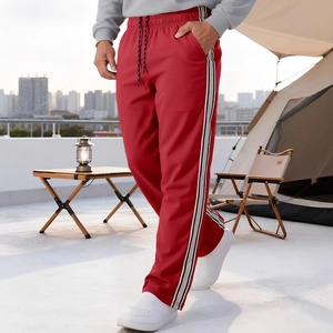 Men's red loose-fit joggers with black and white side stripes for outdoor urban camping