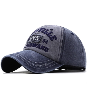 Close-up of vintage embroidery and stitching on a washed cotton baseball cap