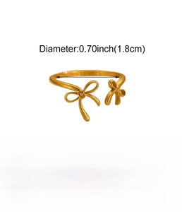 Detailed view of golden bow stainless steel ring with 1.8cm diameter and 0.9g weight