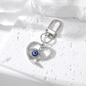 Sparkling crystal heart keychain with blue evil eye charm and silver lobster clasp accessory