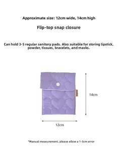 Close-up of a purple quilted storage bag with heart patterns and dimensions