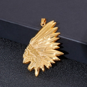 Detailed close-up of golden Indian chief pendant with intricate facial and feather textures