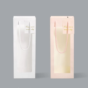 Minimalist rectangular paper gift bags with large clear windows and silk rope handles
